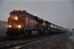 Grain train rolls west through the rain
